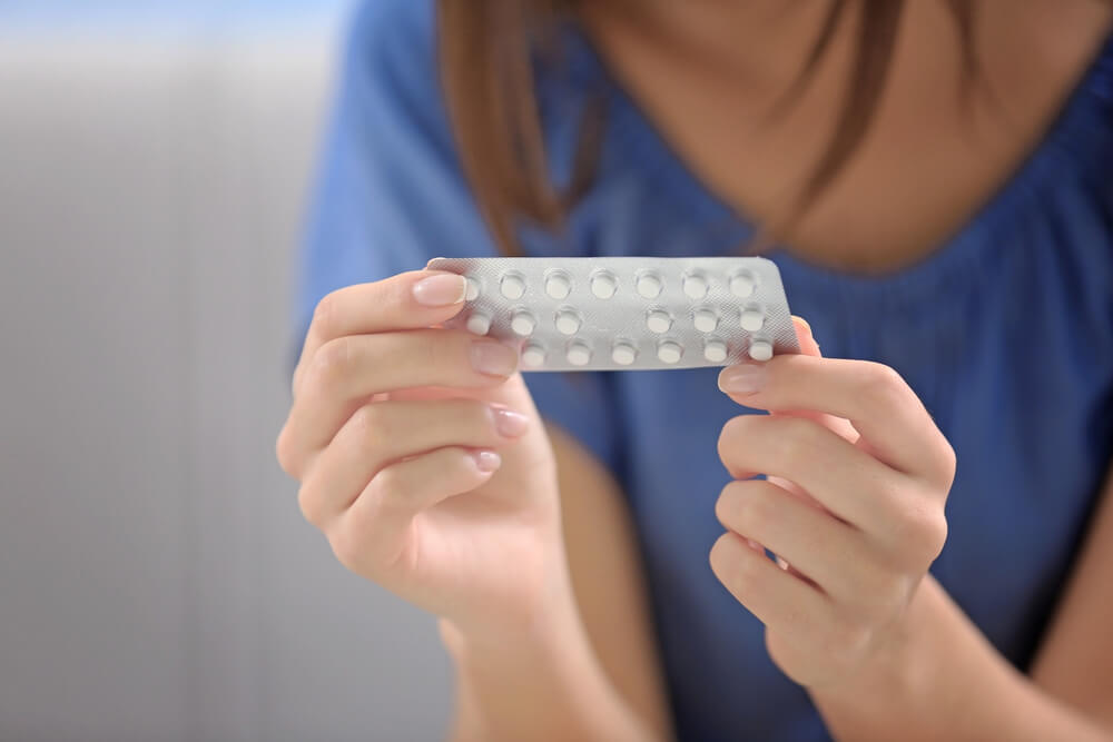 Young Woman With Pills at Home, Closeup. Gynecology Concept