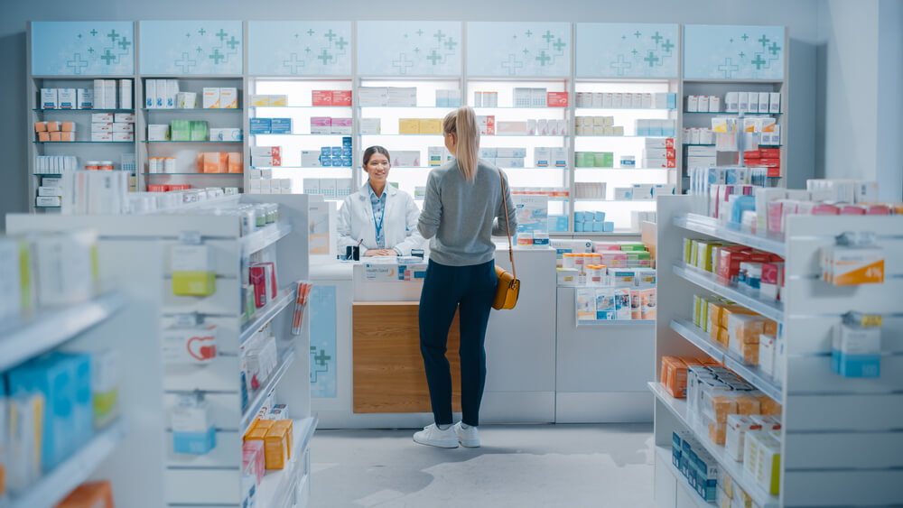 Pharmacy Drugstore: Beautiful Young Woman Buying Medicine