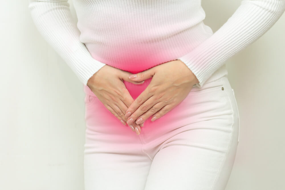 Woman Hands on Front Stomach Painful