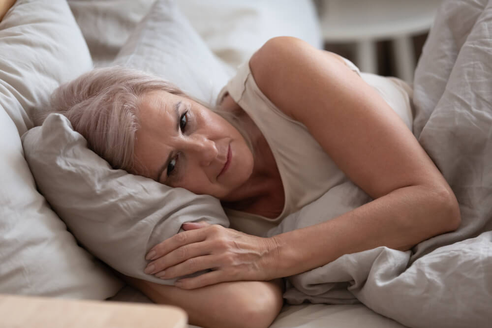 Close up View Sleepless Middle-Aged Woman Lying in Bed Suffers From Insomnia