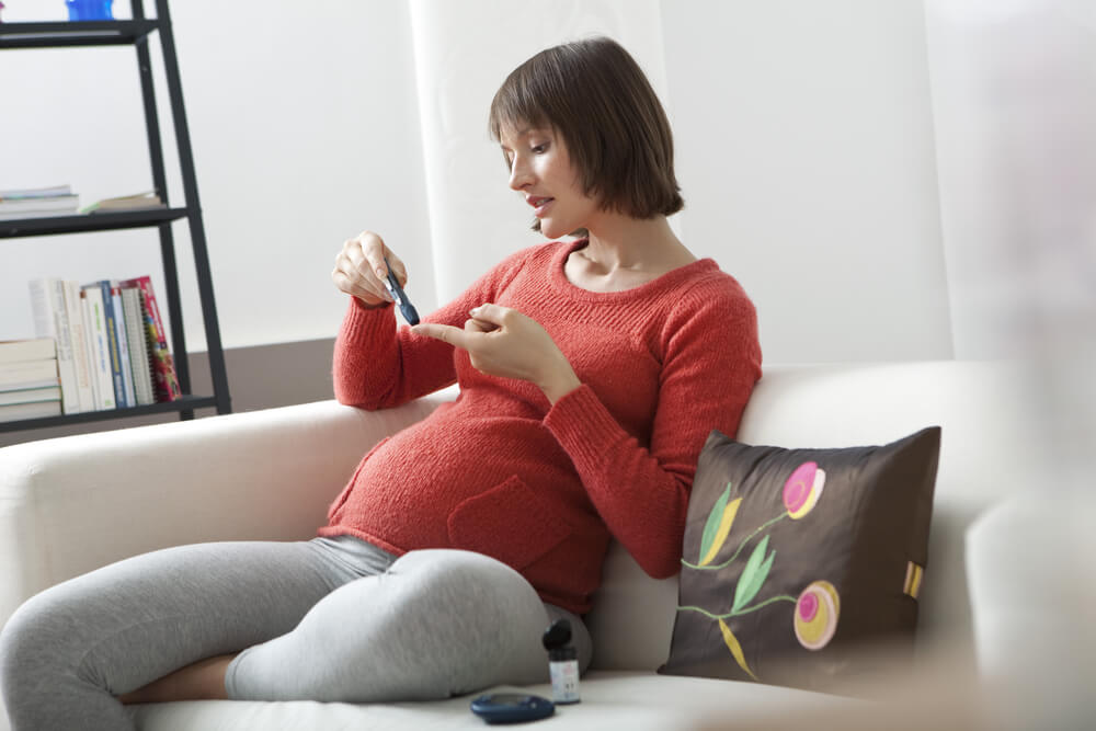 Woman Sitting on Bench Doing Test for Diabetes Pregnant Woman