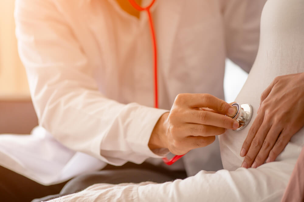Doctor Examines Pregnant Woman