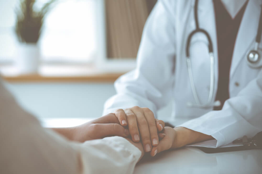 Woman-doctor Reassuring Her Female Patient, Close-u