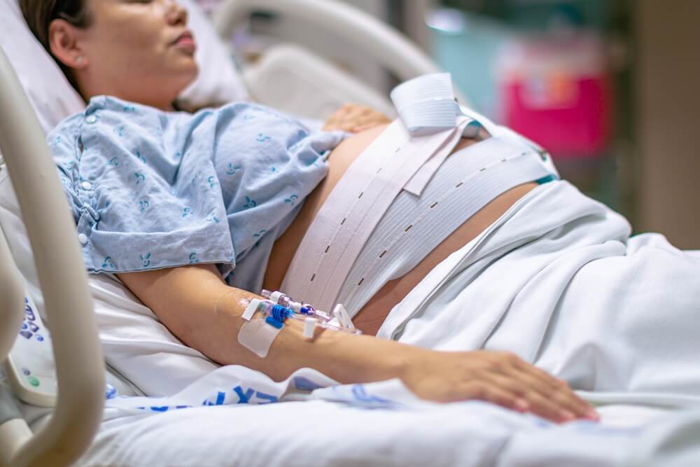 A Woman in Labor, Giving Birth in the Hospital.