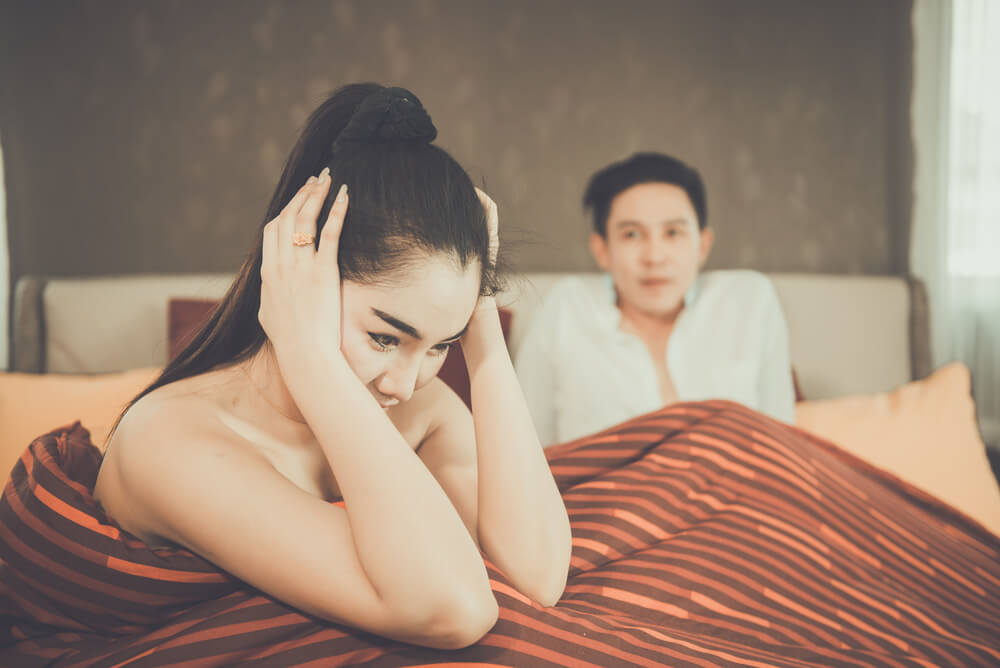 A woman on the bed after sex with boyfriend