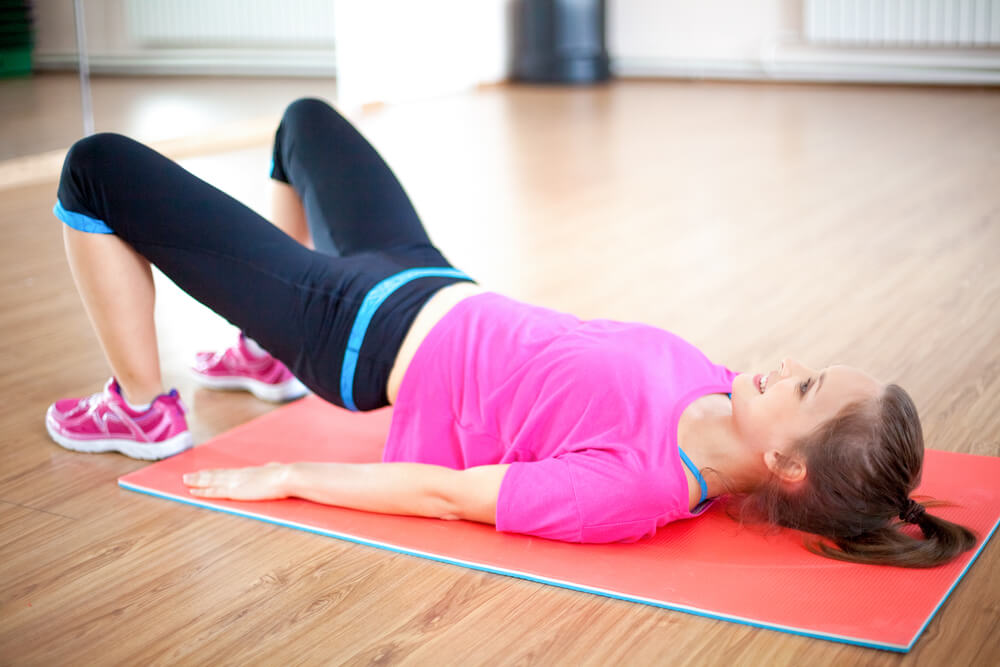 A woman doing abdominal pelvic exercise