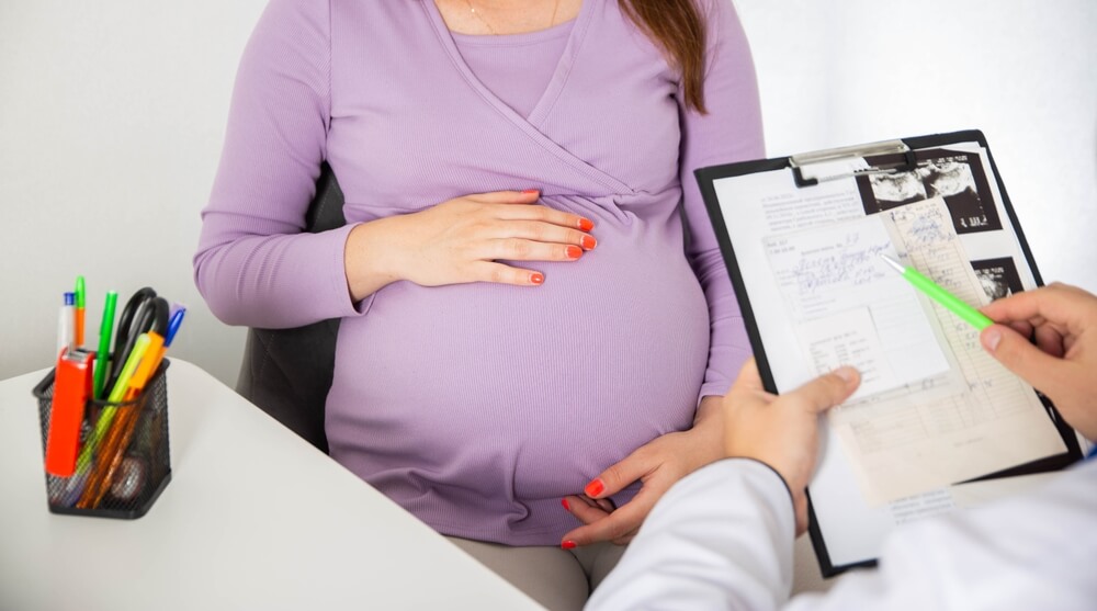 Pregnant girl at the doctor's consultation. The results of blood tests of a pregnant girl.