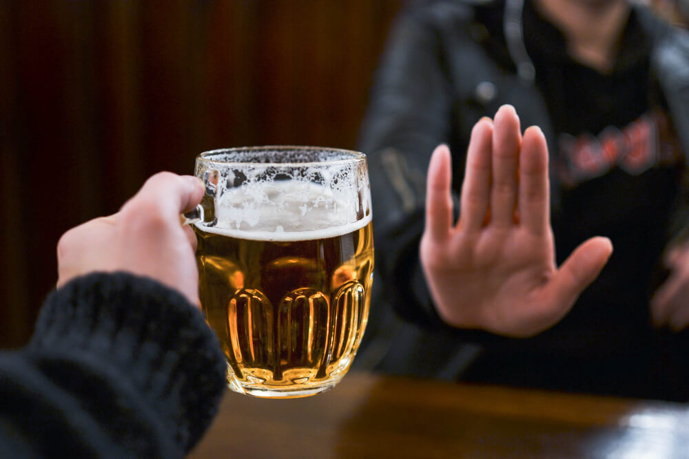 Woman Saying No to Beer 