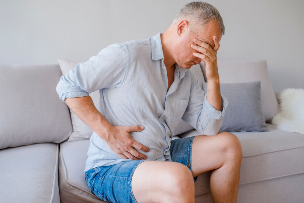 Hand of Old Man Holding Stomach Suffering From Pain Diarrhea Indigestive Problem