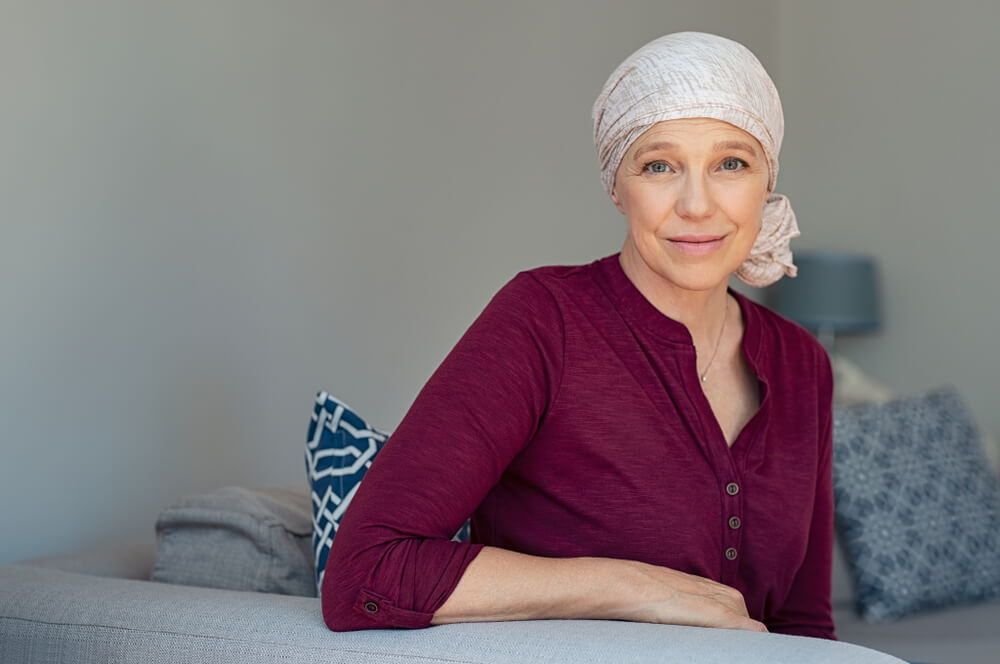 Portrait of mature lady facing side-effects of hair loss.