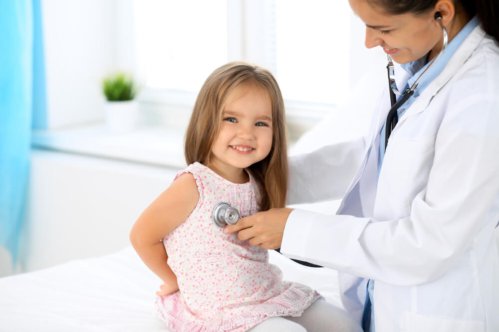 Doctor Examining a Little Girl by Stethoscope