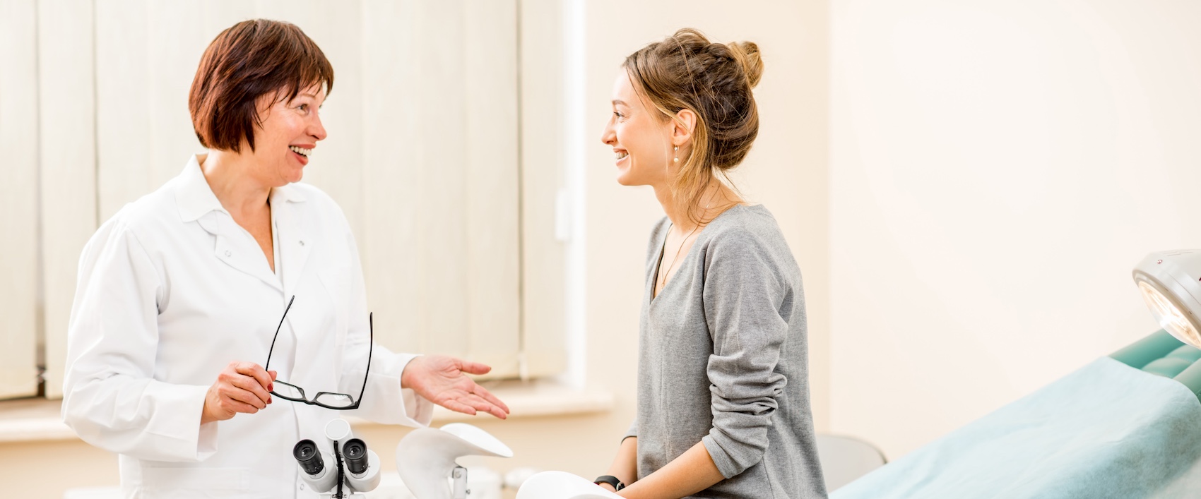 Young woman patient with gynecologist in the office