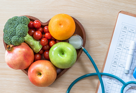 Fruit and Vegetables in a Heart Shaped Wooden Bowl