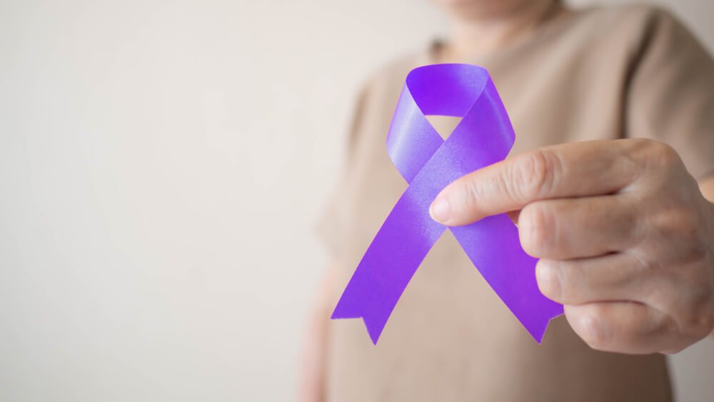 Elderly Woman Holding Purple Ribbon Awareness
