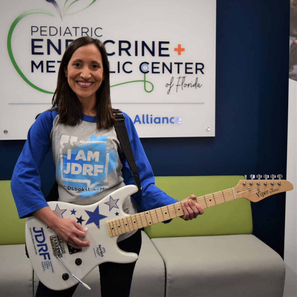 Woman in a Waiting Room Playing a Guitar