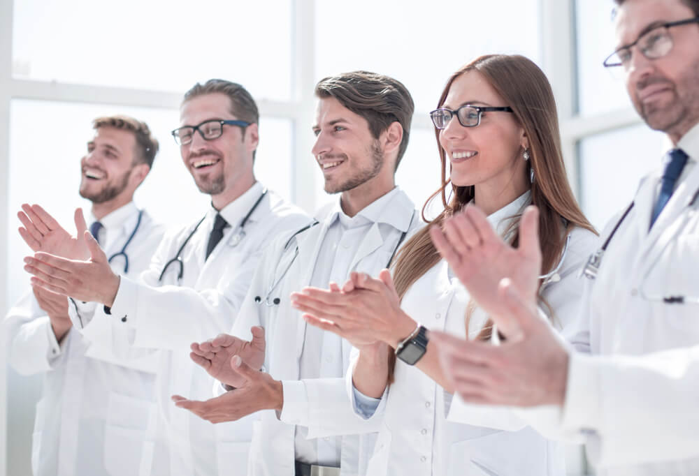 Group of Successful Doctors Applauds