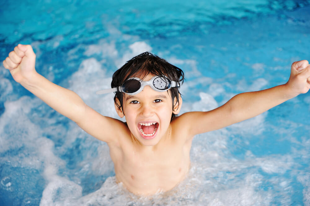 Young Boy Happy in the Pool