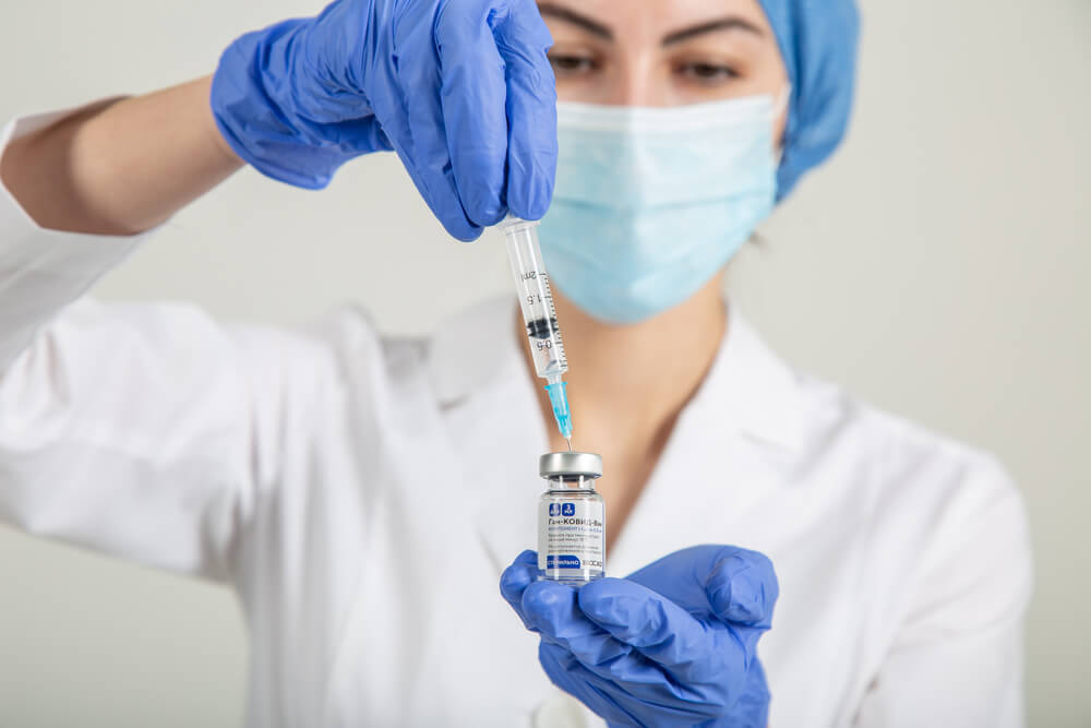 Nurse Holding a Vial of a Vaccine