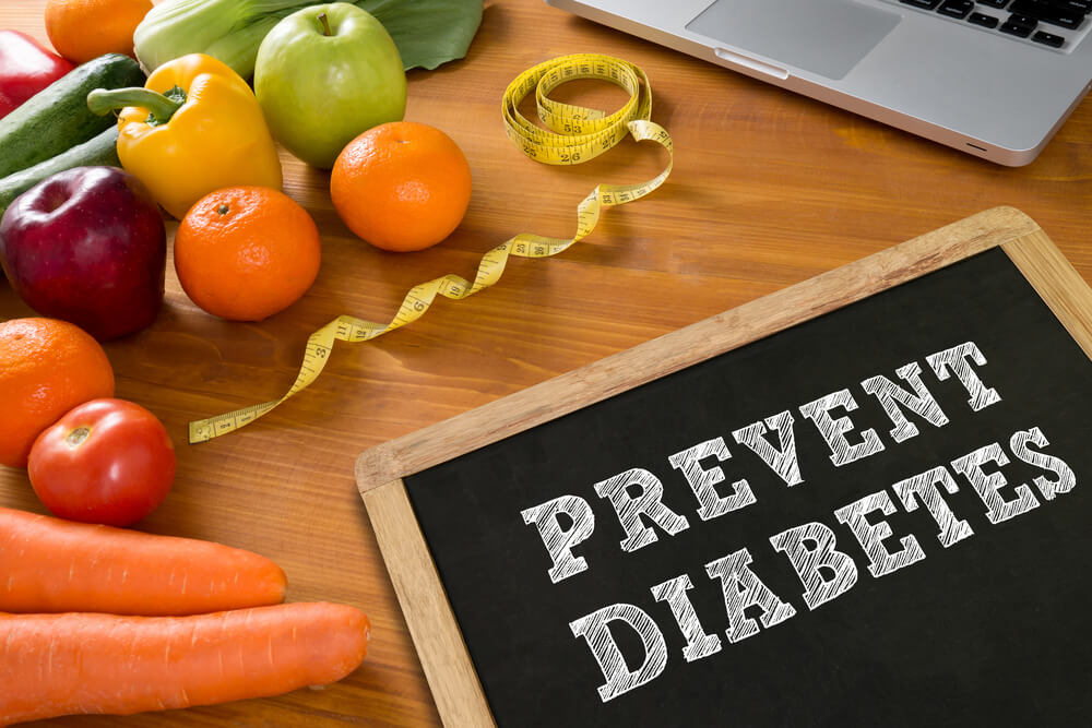 Prevent Diabetes Concept, Fruit and Tape Measure on a Wooden Table