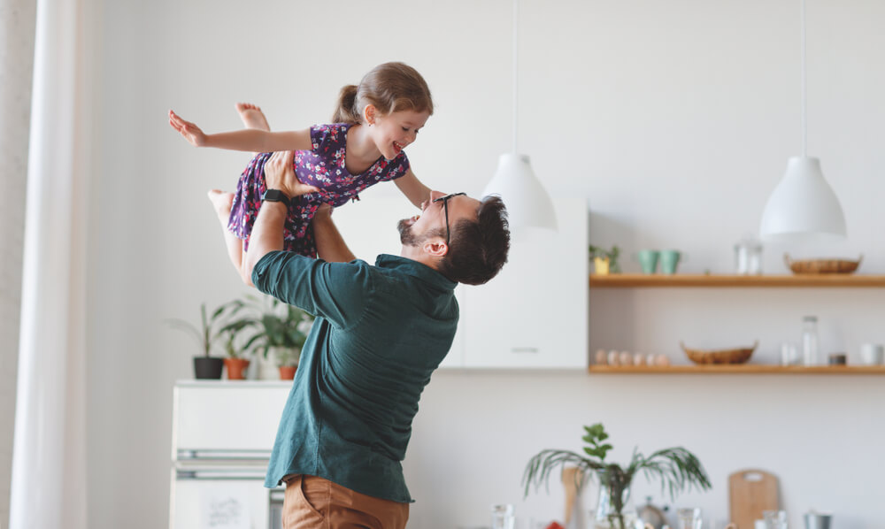 Happy Family Daughter Hugs His Dad on Holiday