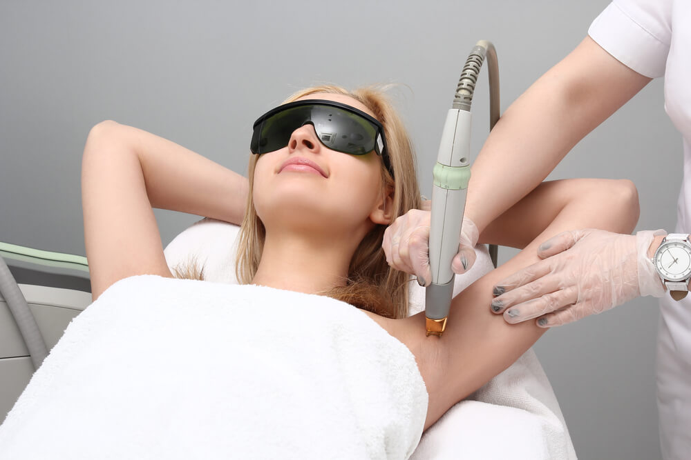 Blonde Woman Having Underarm Laser Hair Removal Epilation.