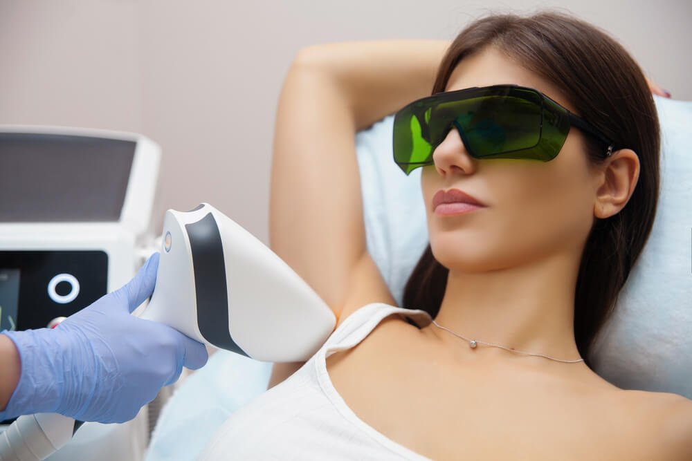 Laser Epilation and Cosmetology in Beauty Salon. Hair Removal Procedure. 