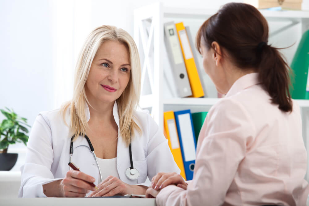 Patient in the Doctor’s Office, She Is Receiving Prescription Medicine. 