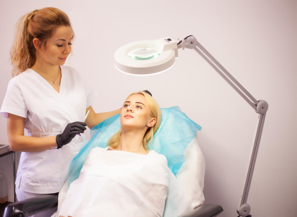South Miami OB/GYN Associates LLC doctor consulting with a patient before facial treatment