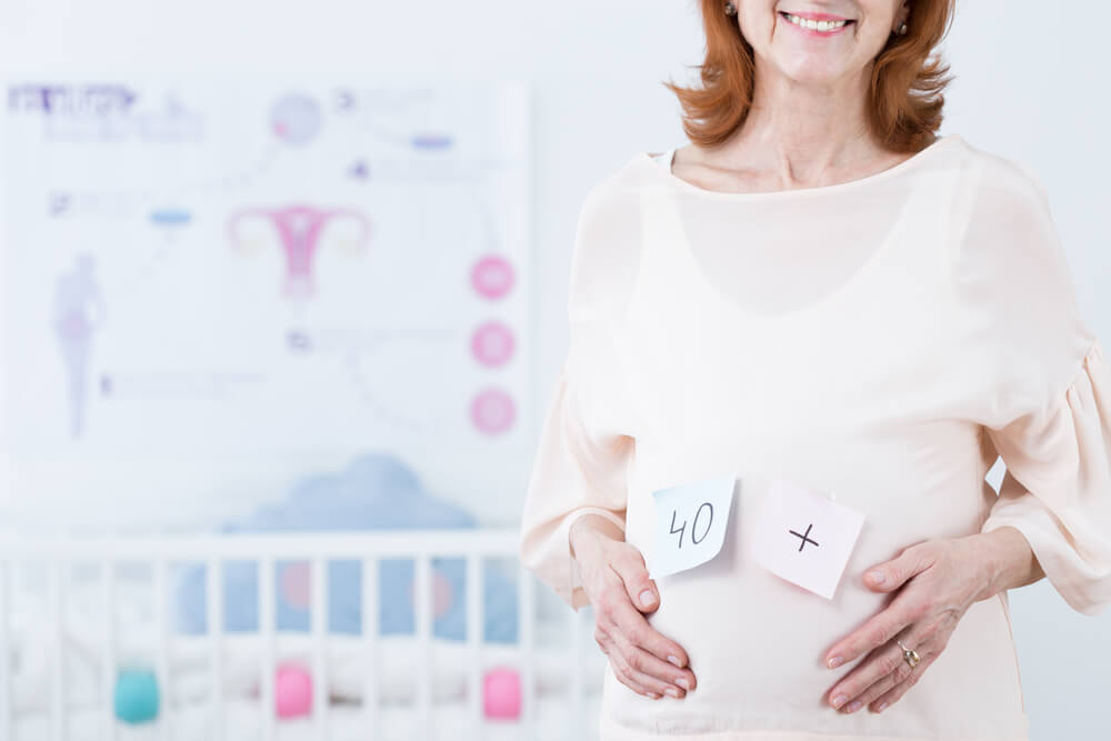 Happy Middle Aged Woman in Pregnant With Her First Baby