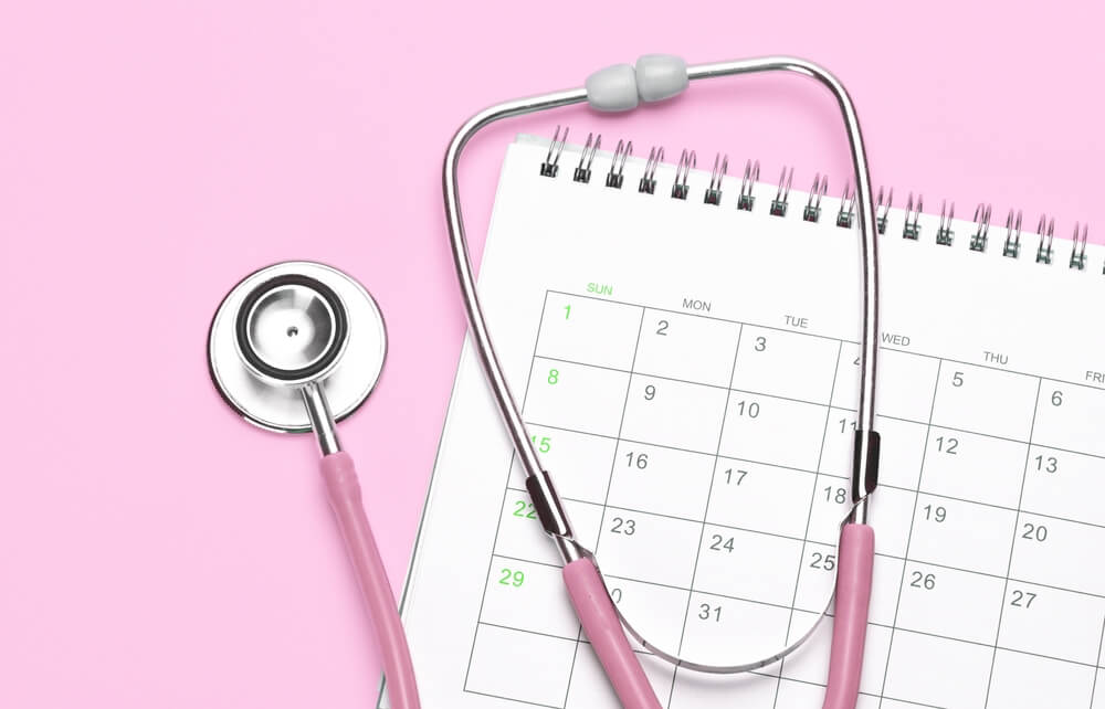 Pink Stethoscope and Calendar on a Pink Background