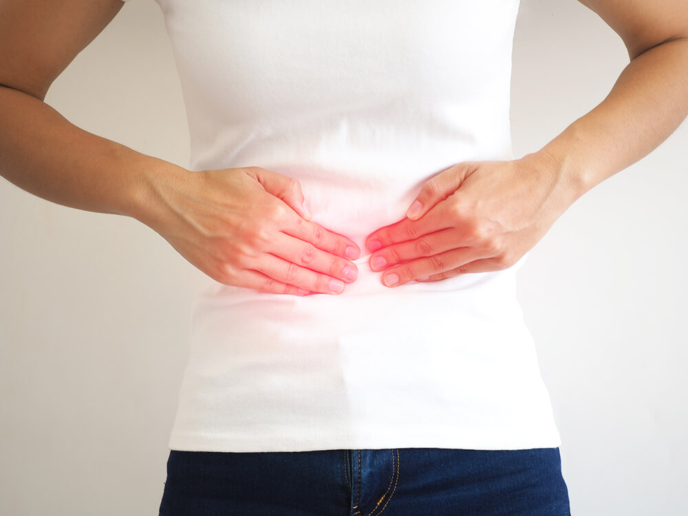Woman With Stomach Pain Causes of Abdominal Pain Include Inflammatory Bowel Disease-Ibd. Stomach Ulcer Irritable Bowel Syndrome (Ibs), Ulcerative Colitis and Microvilli.