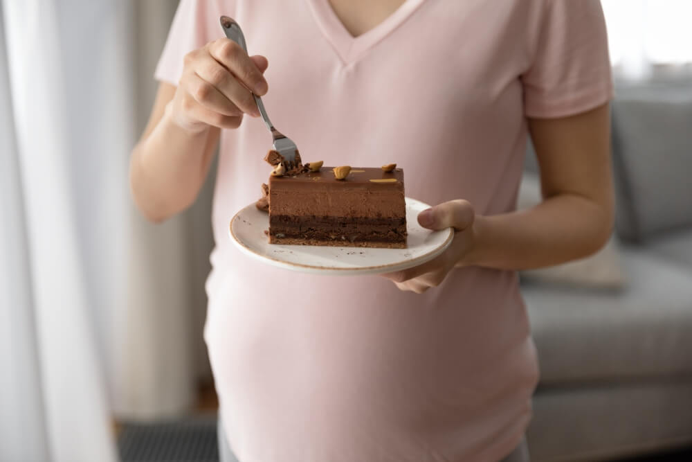 Pregnant Woman Enjoy Chocolate Cake