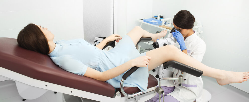 A Gynecologist Examines the Uterine Cavity Using a Colposcope.