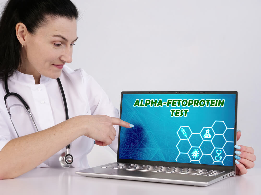 Alpha-fetoprotein Test Phrase on the Screen. Medico Use Internet Technologies at Office.