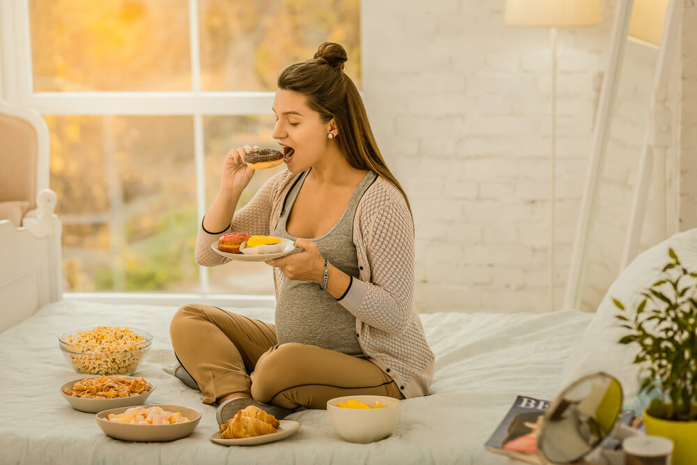 Woman Eating a Lot of Sweets While Pregnancy