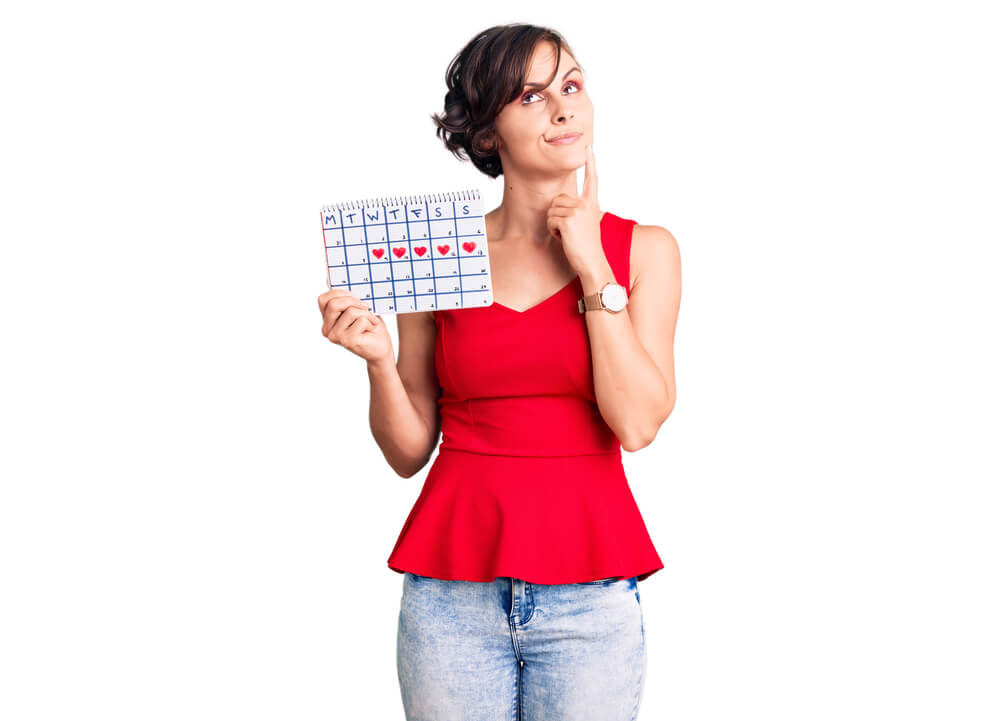 Beautiful Young Woman With Short Hair Holding Menstrual Calendar