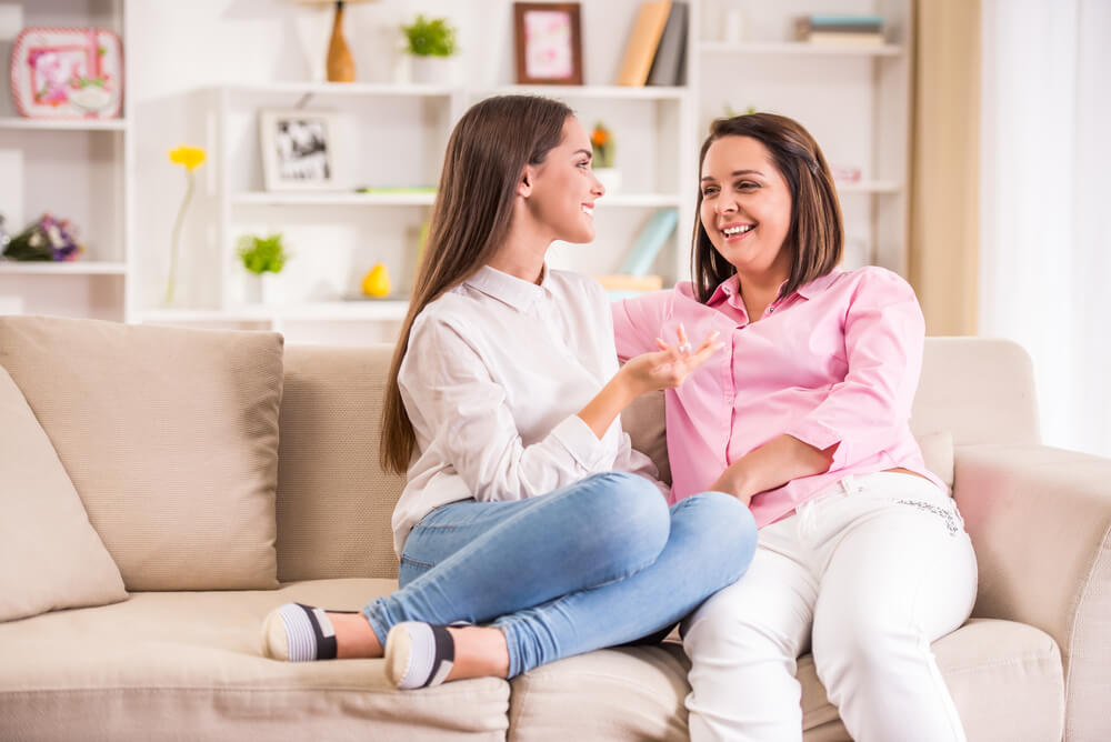 Mother and Teen Daughter at Home Talking