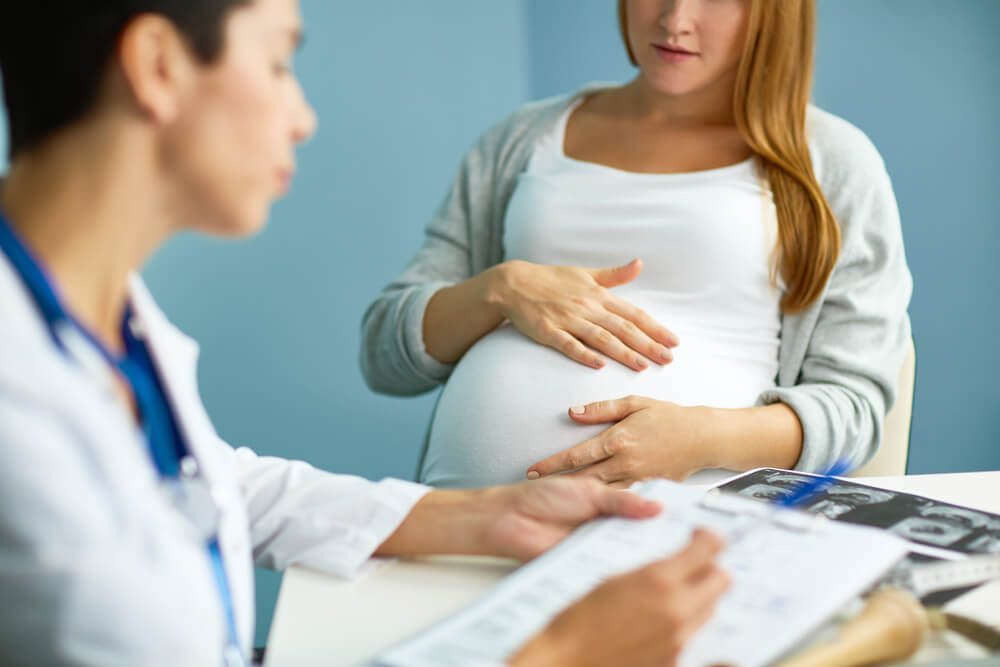 Pregnant Woman With Doctor at Hospital