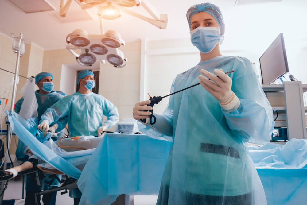 Process Of Gynecological Surgery Operation Using Laparoscopic Equipment Group Of Surgeons In Operating Room With Surgery Equipment