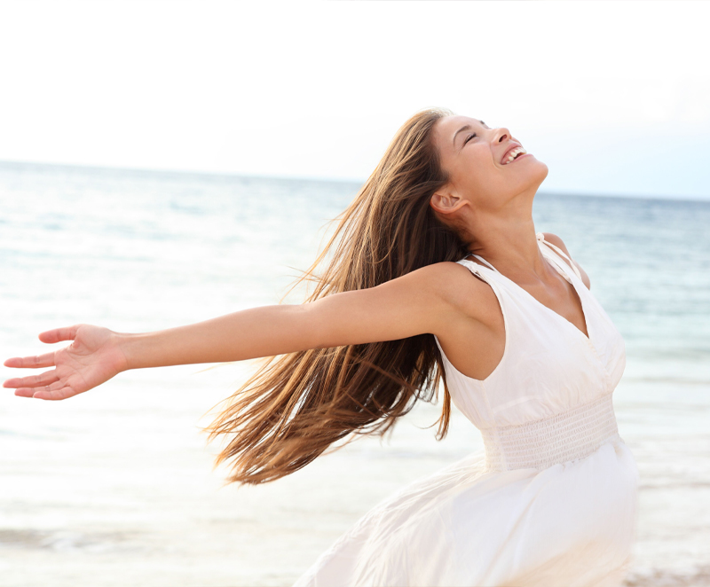 Other-service Happy woman at a beach in white dress