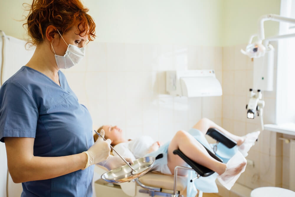 doctor gynecologist performing an examination