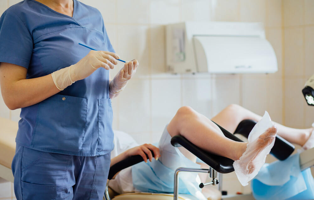 gynecologist working with patient
