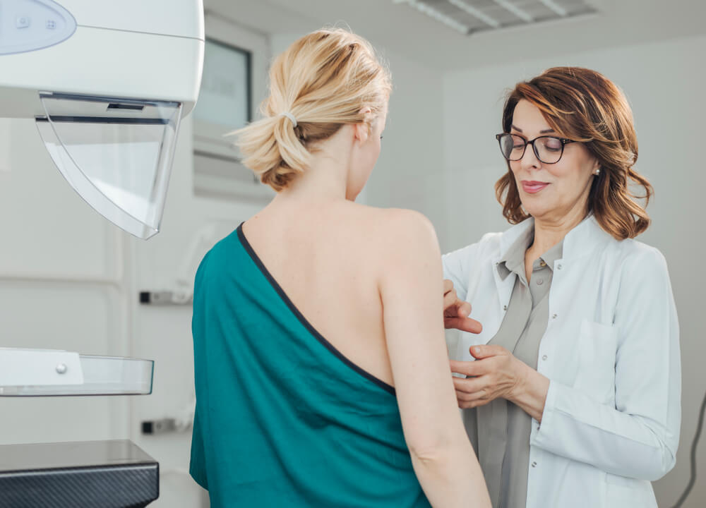 Woman Gynecologist Doing Breast Exam to Her Patient