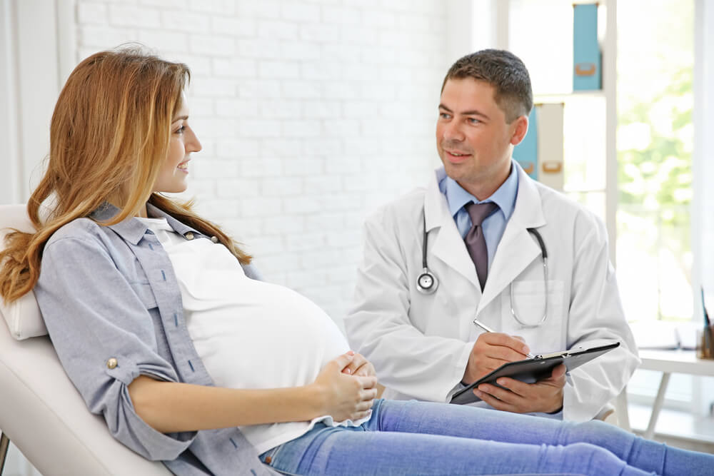 Pregnant Young Woman Visiting Doctor