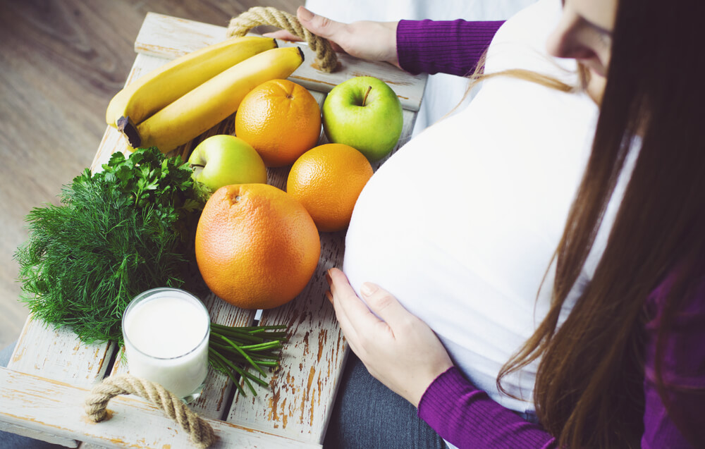 Pregnant Woman With Fruits and Vegetables.