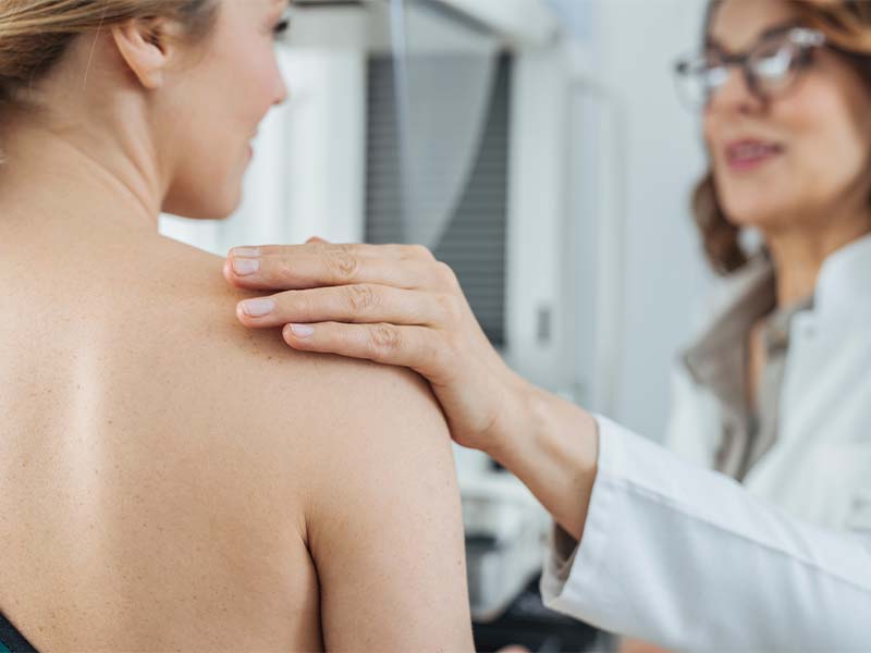 woman being comforted by doctor