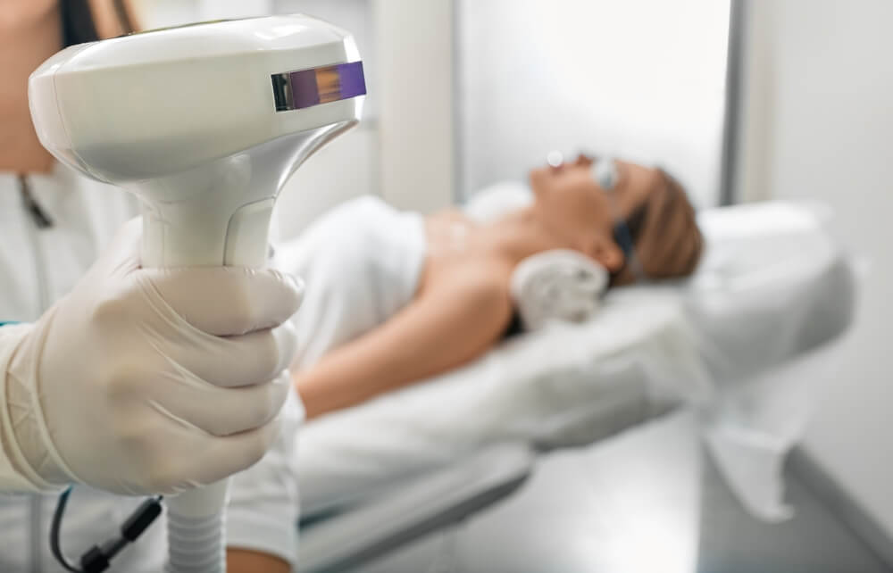 Beautician Holding Lumecca Device With Intense Pulsed Light Ipl Technology for Photorejuvenation of a Woman’s Body and Removal of Brown Spots and Freckles