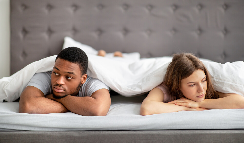 Couple Unhappy in Bed