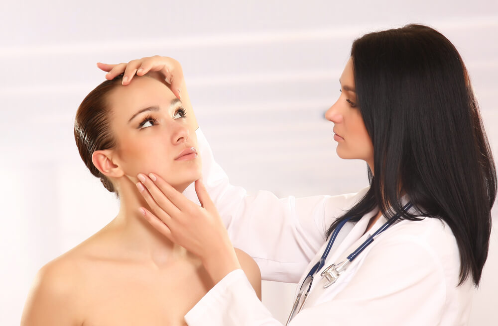 Pretty Doctor Examining Beautiful Young Female’s Face