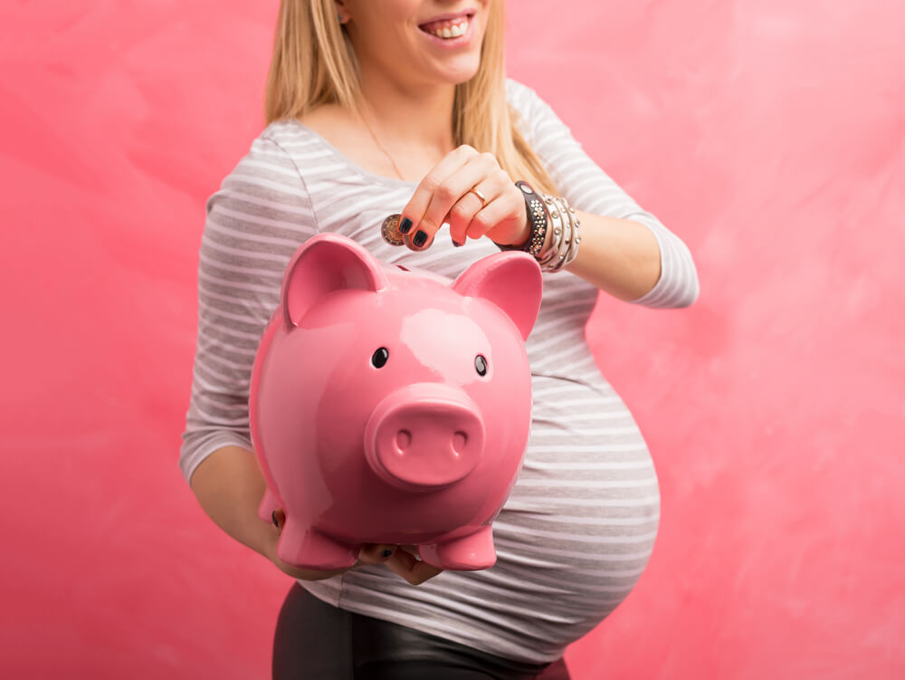 Woman Holding a Piggy Bank